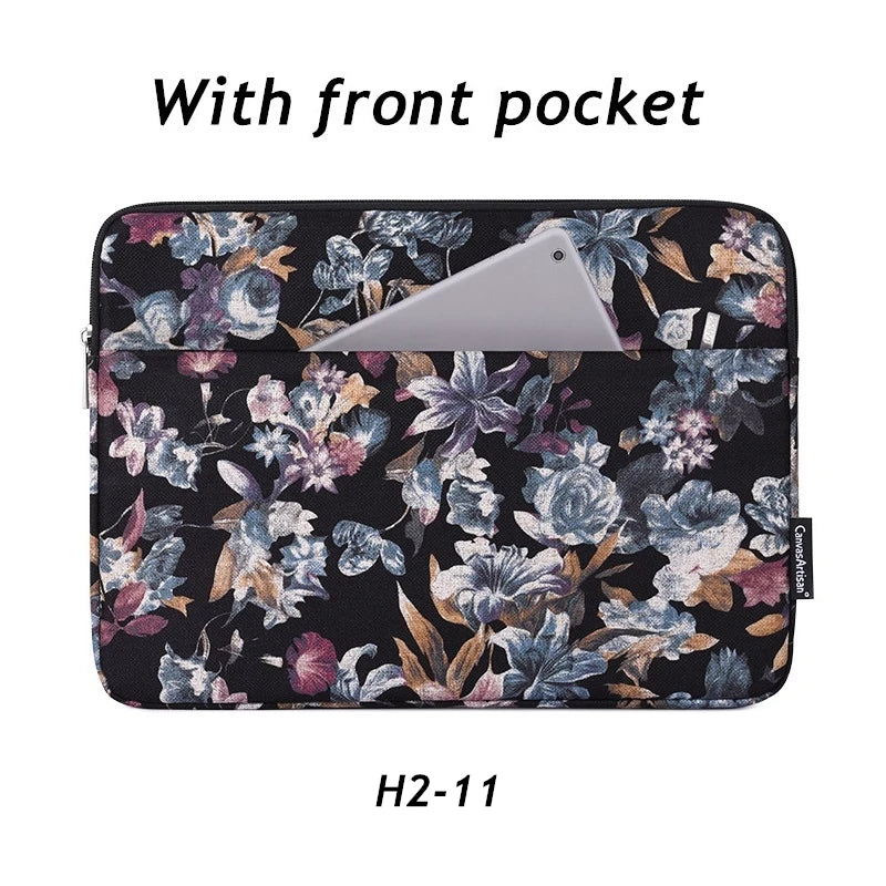 Black floral laptop sleeve with a front pocket and a light gray phone visible inside.