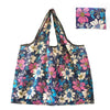 A floral patterned canvas tote shopping bag featuring pink, blue, and white flowers.