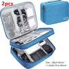 A blue portable digital organizer storage pouch with an open lid showing various electronic accessories and tools.