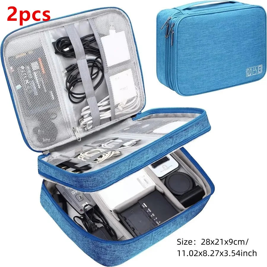 A blue portable digital organizer storage pouch with an open lid showing various electronic accessories and tools.