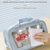 A light blue double-layer wash bag is shown open, demonstrating its stain-resistant features with a red stain on a white clot