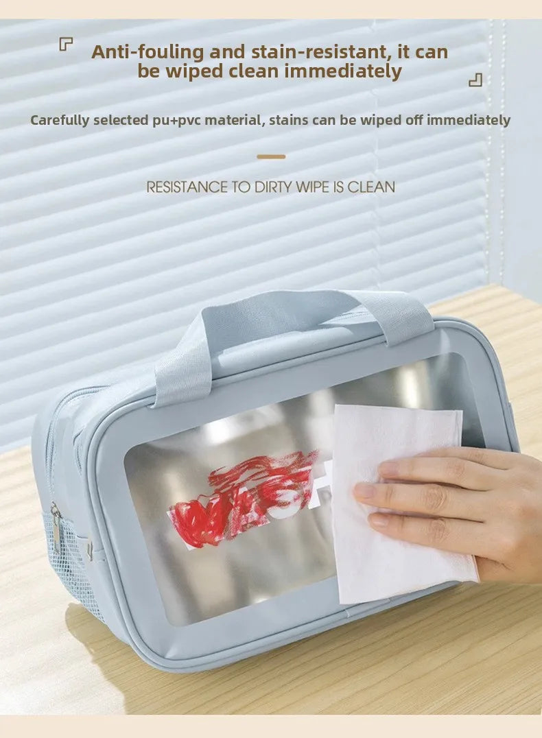 A light blue double-layer wash bag is shown open, demonstrating its stain-resistant features with a red stain on a white clot