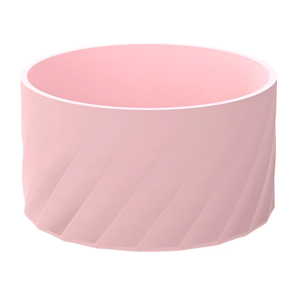 A pink silicone boot sleeve designed to fit water bottles.