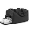 Black waterproof travel duffle bag with a separate compartment for shoes.