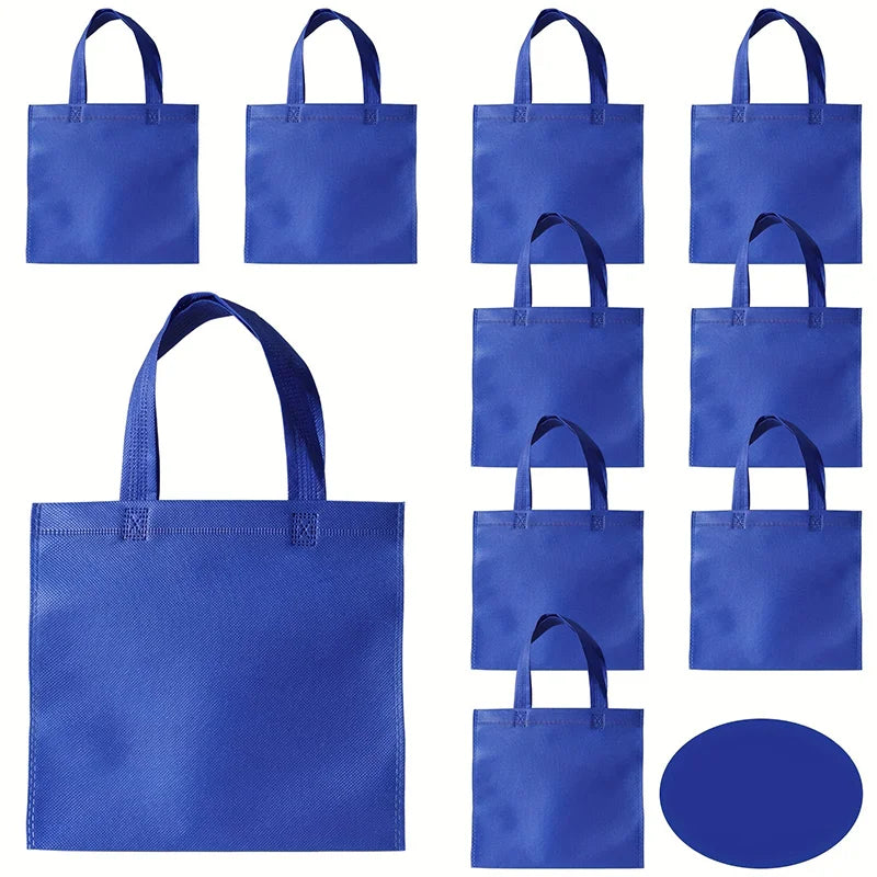 A set of royal blue non-woven tote bags with handles shown in various sizes and angles.