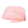 A pink silicone coin pouch with multiple drainage holes.