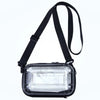 A clear plastic shoulder crossbody cosmetic bag with a black strap.