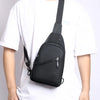 A black men's adjustable crossbody sling bag worn by a person in a white t-shirt.