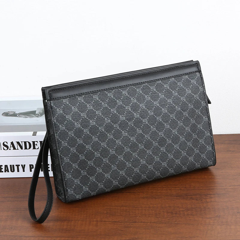 A black leather wallet or clutch with a diagonal pattern and a black strap resting on a wooden surface.