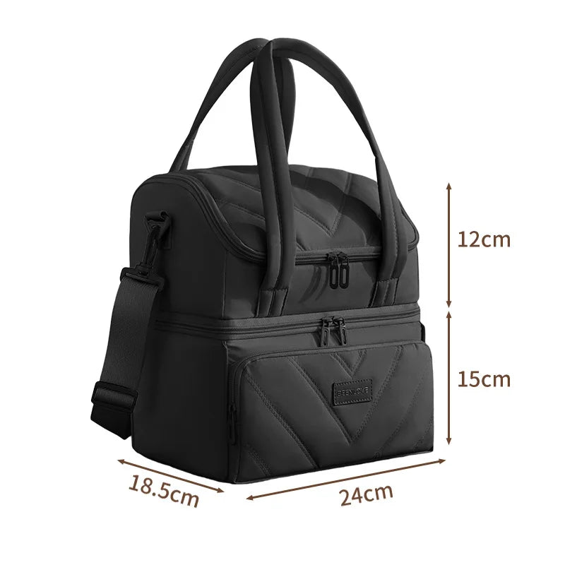 A black double-layer insulated lunch bag with carrying handles and zippered compartments.