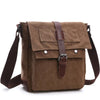 A brown canvas messenger bag for men with leather straps and buckles.