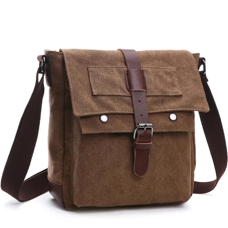 A brown canvas messenger bag for men with leather straps and buckles.