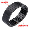 A close-up view of a black polished stainless steel watch band with matte finish texture.