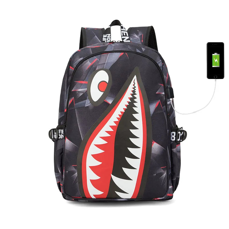A black and gray casual travel backpack with a red and white graphic design and a black electronic device attached.