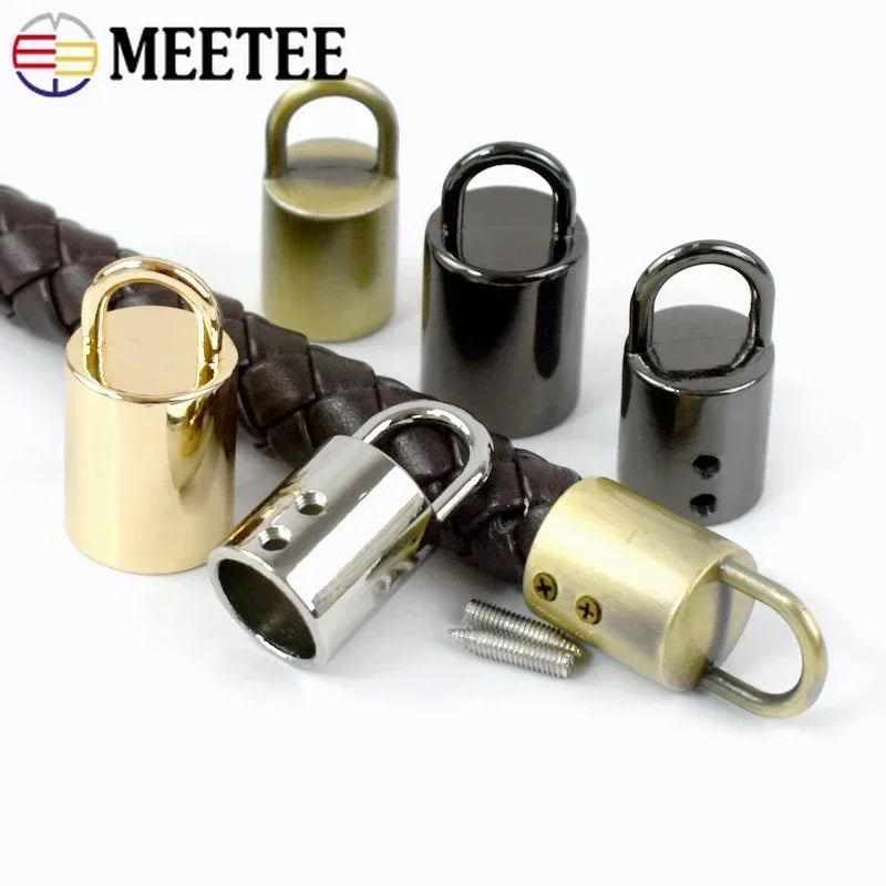 A collection of metal cord lock buckles in various finishes and sizes for bags, straps, and crafts.