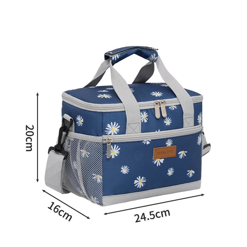 A navy blue insulated thermal lunch bag with a light gray strap and floral pattern.