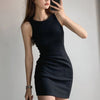 A woman models a black sleeveless bodycon tank dress with a slim fit mini style.