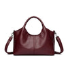 A deep burgundy leather women's casual crossbody shoulder bag with a zip closure.