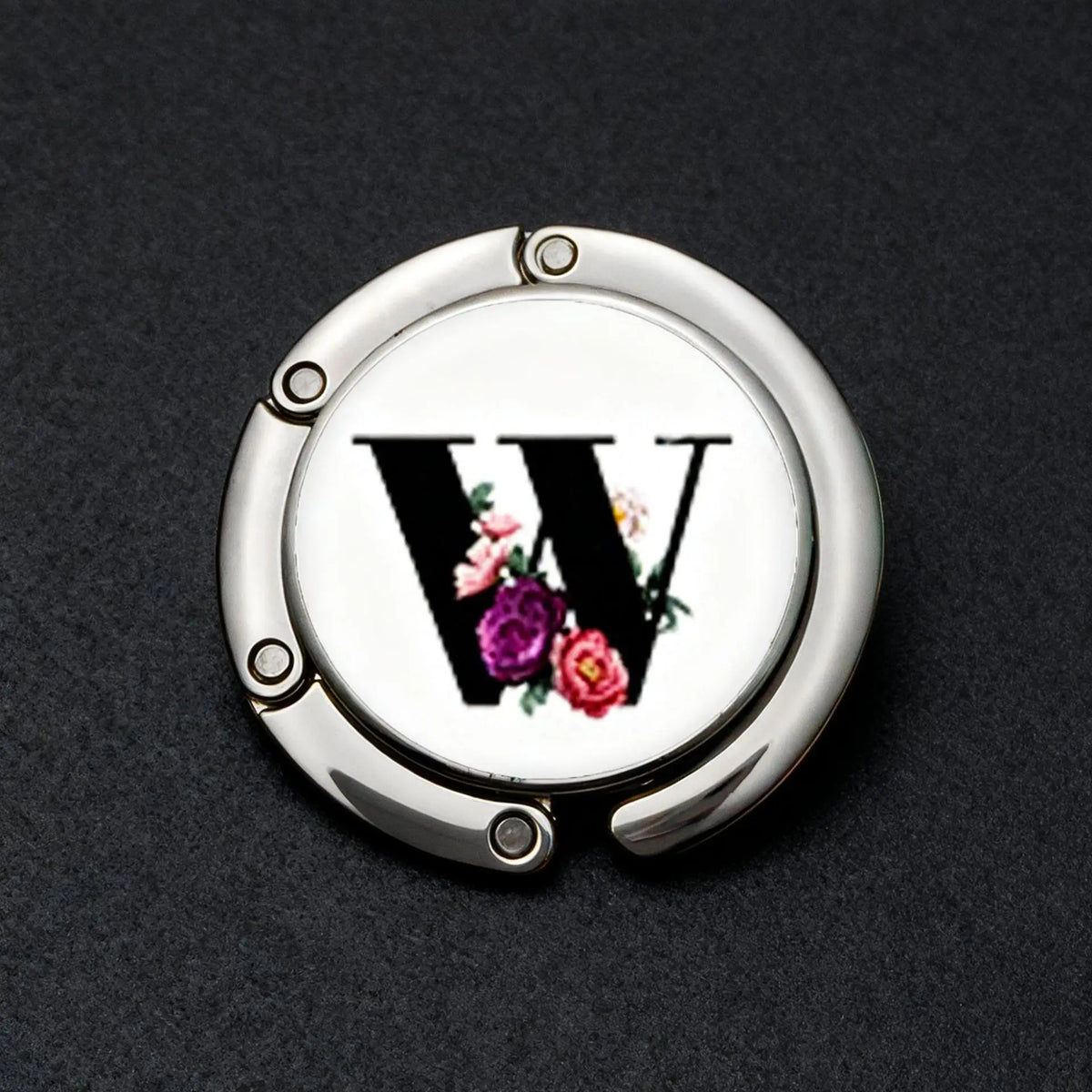 Silver foldable letter hanger hook with a stylized W design and floral accents