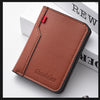 A brown leather credit card wallet with stitching and a red pull tab resting on a white surface.