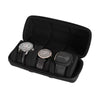 Black watch organizer case with soft lining holding several watches and a smartwatch.