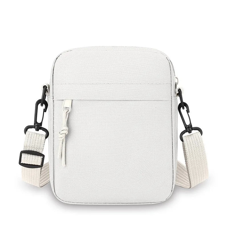 Sac bandoulière blanc unisexe avec sangles réglables et fermeture éclair.