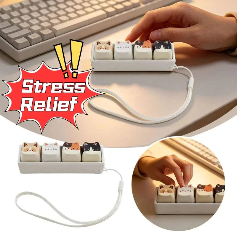 A white cat keycap fidget toy is shown in a small tray with a lanyard, demonstrating stress relief.