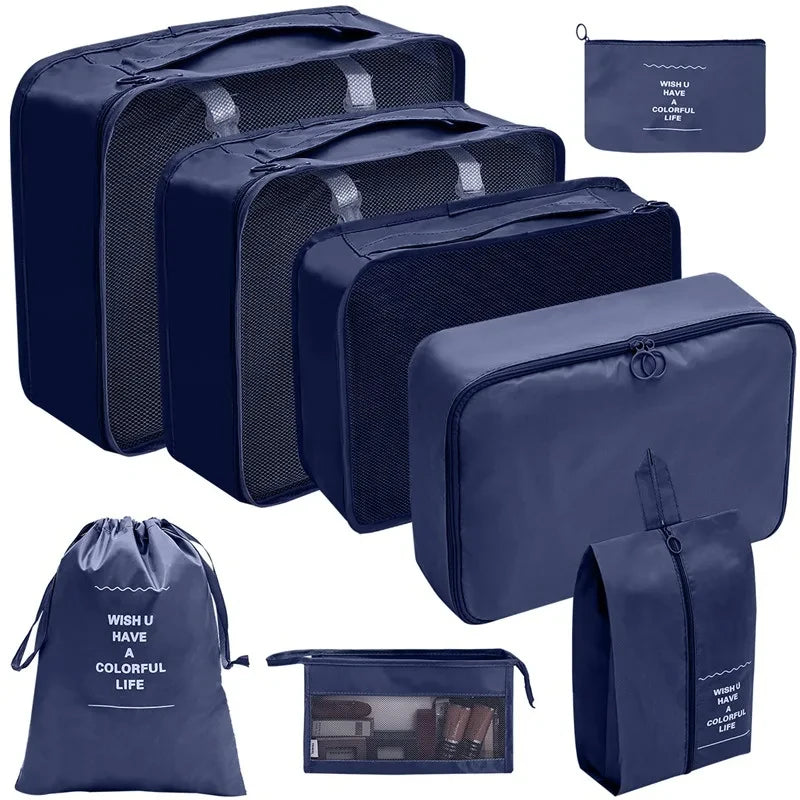 A set of dark blue fabric storage organizers and a matching drawstring bag for keeping items organized