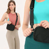 A woman wearing a black waist bag across her chest and a teal top, demonstrating the fanny pack style.
