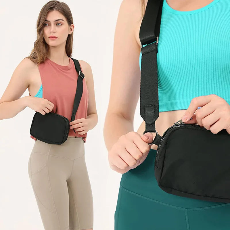 A woman wearing a black waist bag across her chest and a teal top, demonstrating the fanny pack style.