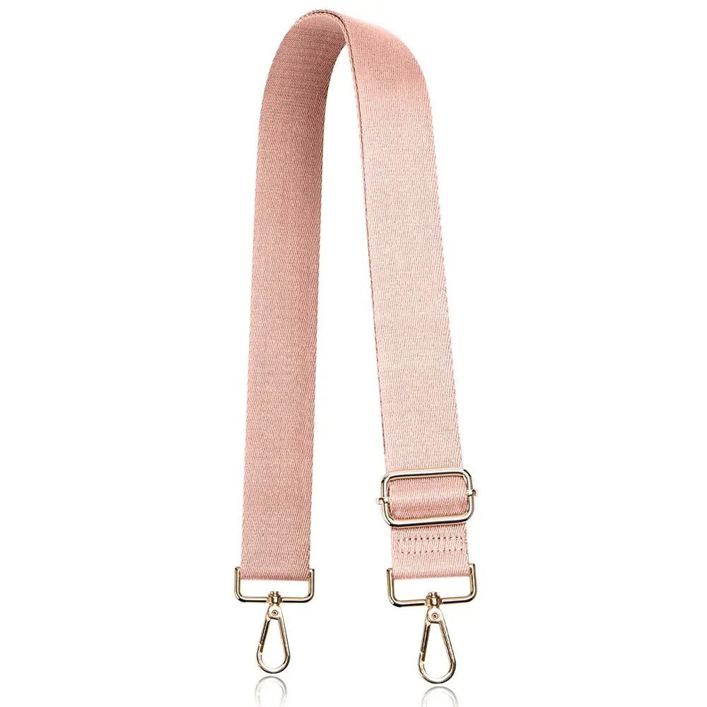A pink nylon crossbody bag strap with gold-toned hardware.