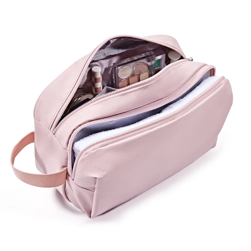 A light pink toiletry bag with a zipper, showing various cosmetic items inside.
