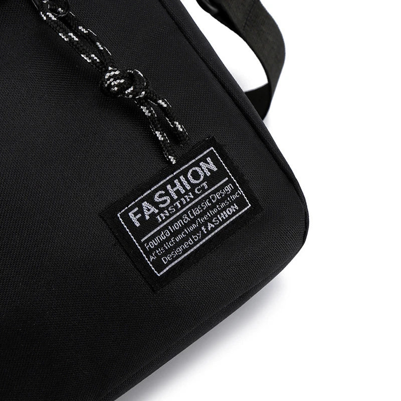 Black minimalist nylon crossbody bag with a silver chain detail