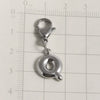 Silver stainless steel alphabet letter charm with a lobster clasp placed on a ruler grid.