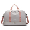 A light gray expandable nylon travel duffle bag with pink straps and zipper details.