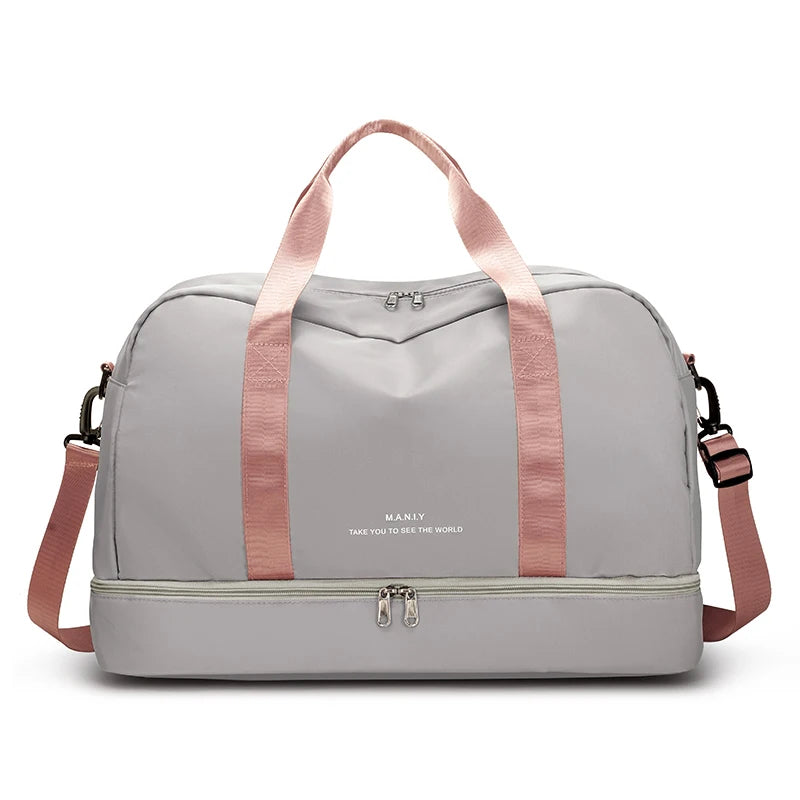 A light gray expandable nylon travel duffle bag with pink straps and zipper details.