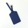 A dark blue PU leather luggage tag with a silver clip attached to a strap.