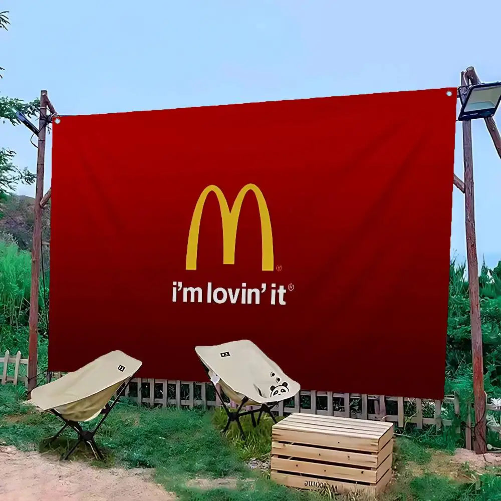 A large red banner featuring the McDonald's logo and the text I'm lovin' it, displayed outdoors.