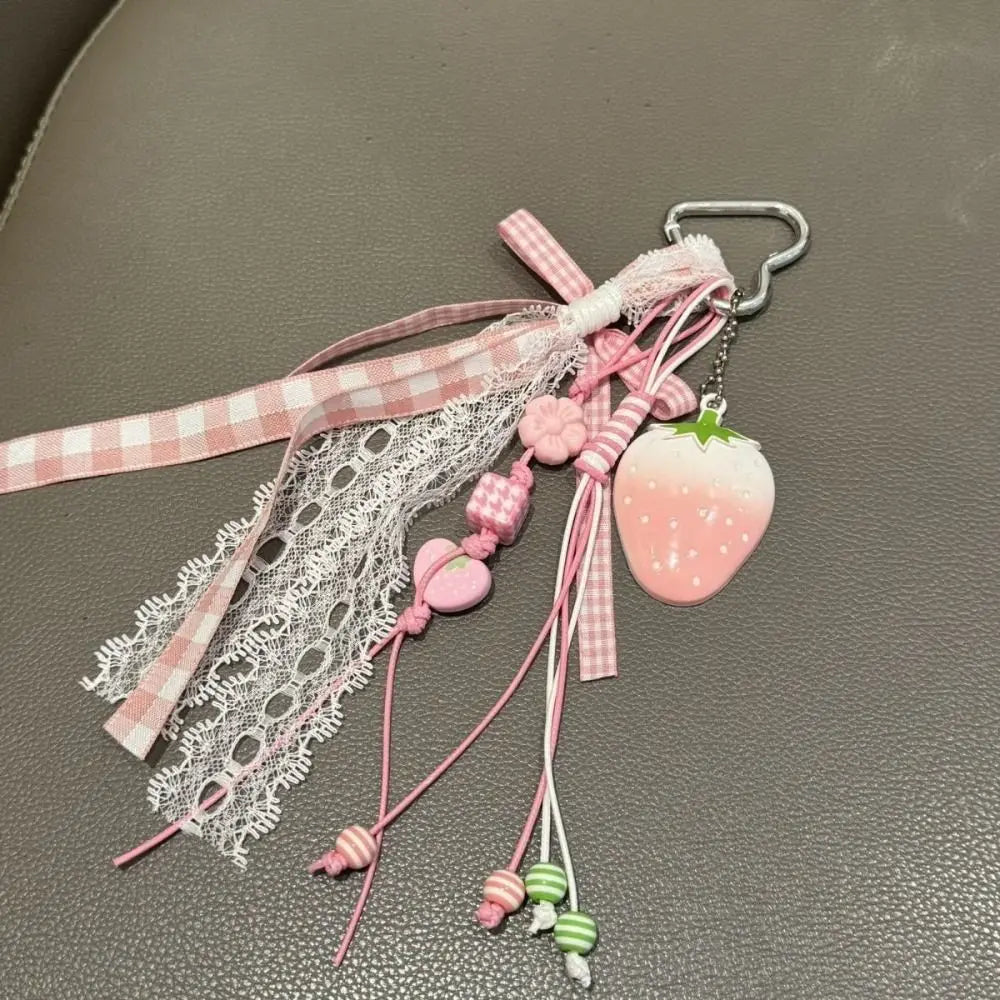 Pink strawberry bag charm keychain with pink ribbon and lace