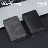 A black PU leather card holder wallet is shown next to a silver laptop, emphasizing RFID protection.