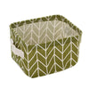A woven storage basket made of olive green and off-white patterned cotton linen for desk organization.