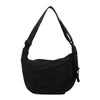 Black canvas crossbody bag shown from the front