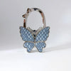 Silver foldable butterfly shaped handbag hook with detailed texture