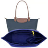 A dark blue felt insert bag designed to organize a handbag.