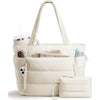 A cream quilted puffer tote bag with pockets and a matching pouch shown in a studio setting.