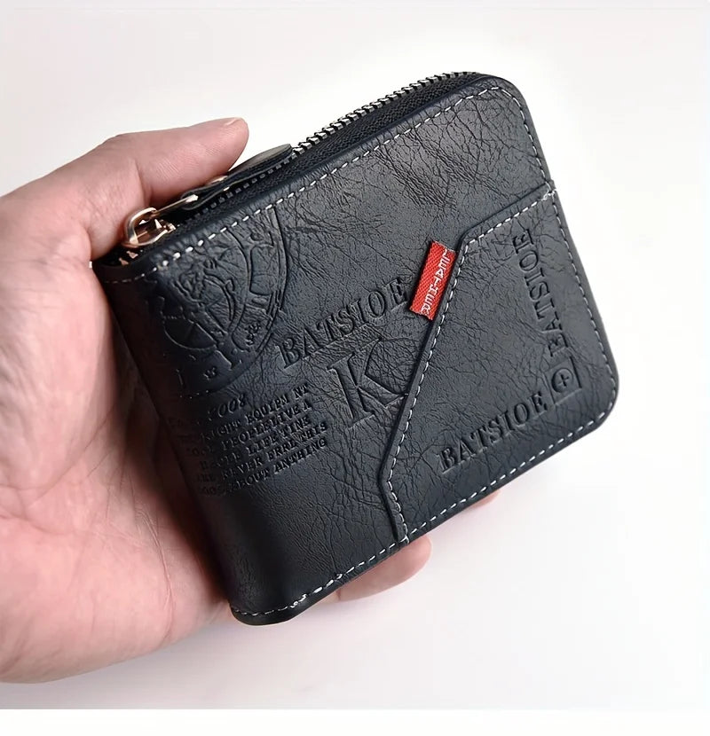 A black slim PU leather wallet with a zipper closure is held in a hand.