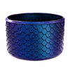 A purple textured silicone boot sleeve designed to fit water bottles.