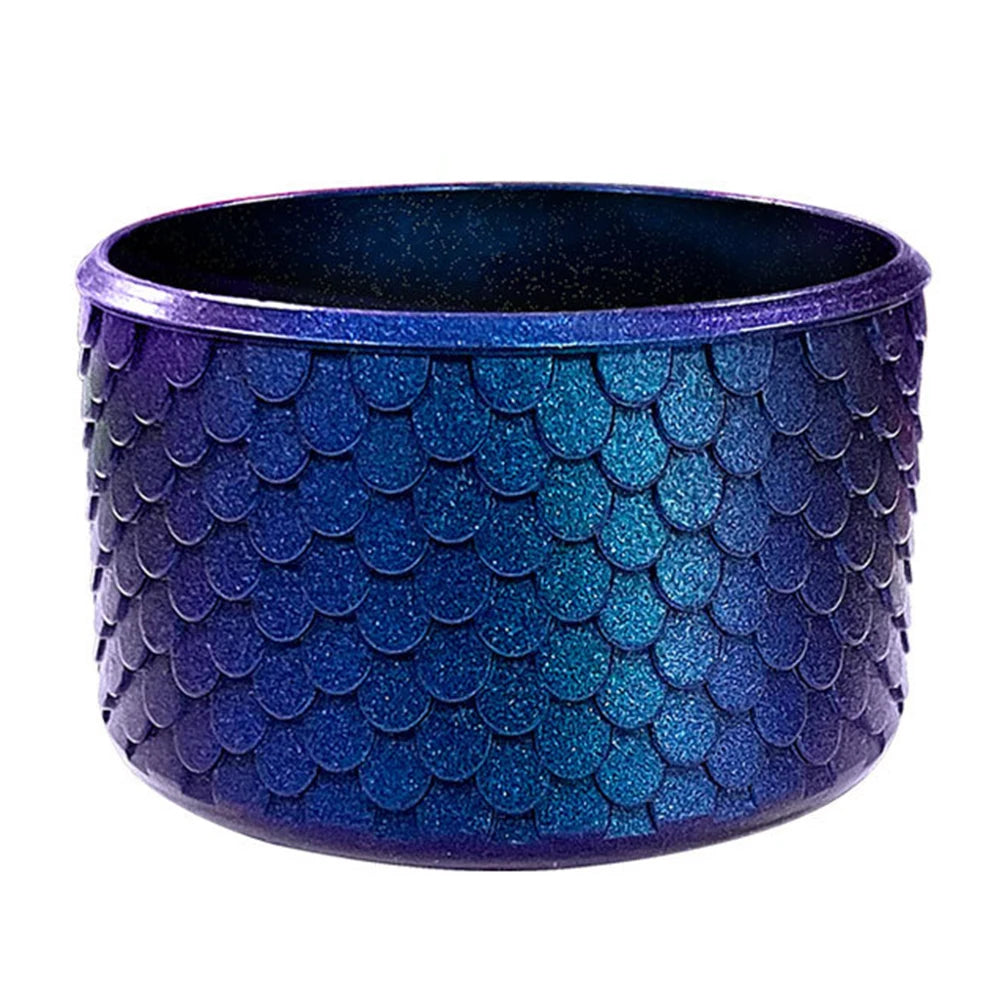 A purple textured silicone boot sleeve designed to fit water bottles.