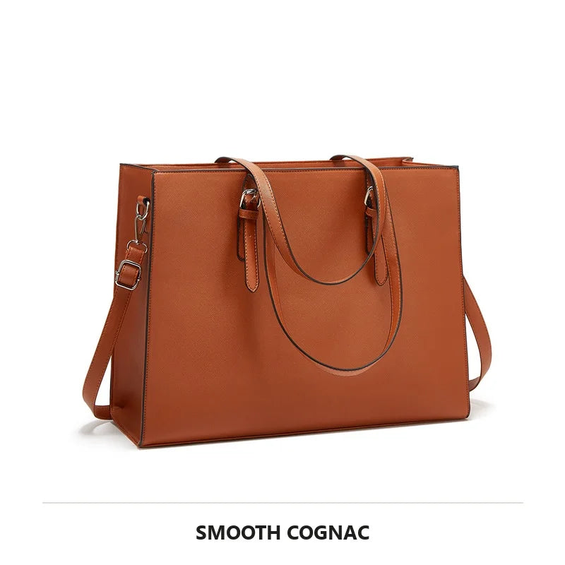 A smooth cognac leather laptop tote bag with leather handles and hardware.