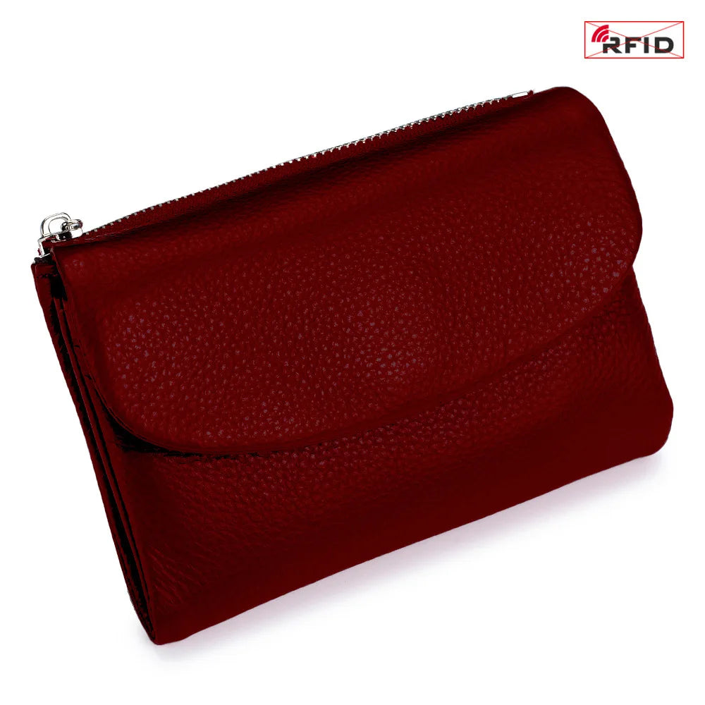 A maroon genuine leather mini card holder wallet with a zippered opening and an RFID logo visible.